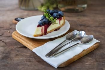 blueberry cheese cake on a wooden table
