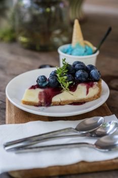 blueberry cheese cake on a wooden table