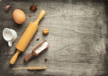 bakery and bread ingredients on wooden background table, top view