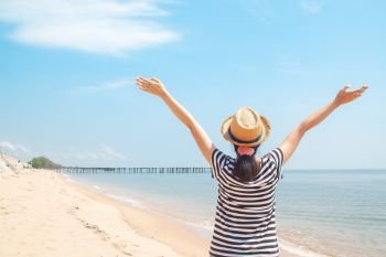 Happy woman enjoying at the beach, Holiday travel concept