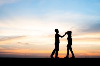 Silhouette of couple upset,man and women are quarrel in sunset t. Silhouette of couple upset,man and women are quarrel in sunset time.