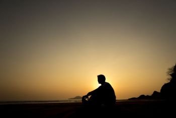 alone man sunset