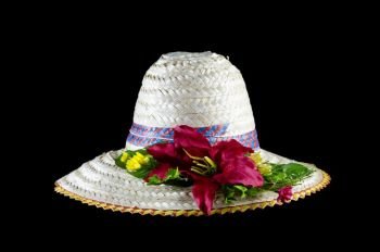 beach hat and flower isolated on black with clipping path