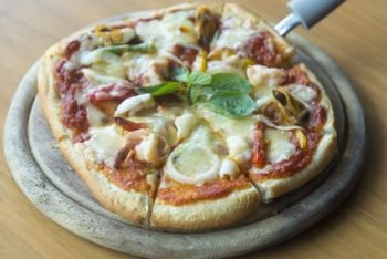 seafood pizza on wooden table