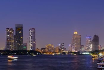 river Mae Nam Chao Phraya in Bangkok with panorama and skyscraper twilight