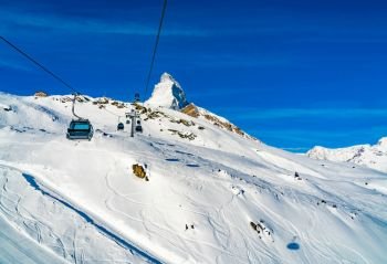 View of cable cars to the snow covered Klein Matterhorn Peak Station at Zermatt Village in Switzerland