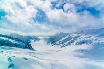 Panoramic view of the snowy Alps Mountain with the famous Aletsch Glacier at Jungfraujoch station in Switzerland