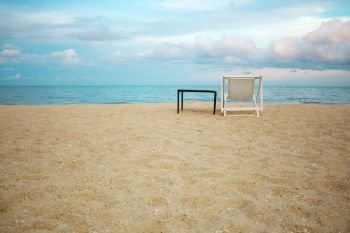 Chair and desk on beach in summer at sky.