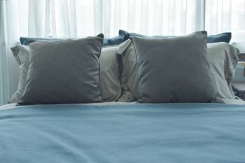 pillows setting on bed with blue color bedding style 