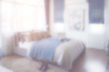 Blurred bedroom interior blue and gray color scheme