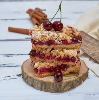  baked cake with cherry, baking of crumbly dough, close up