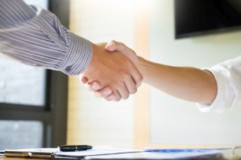 Close up of a business handshake, finishing up a meeting acquisition Greeting Deal concept