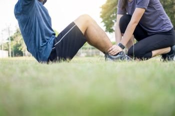 Early morning workout, Fitness couple stretching outdoors in park. Young man and woman exercising together in morning, Relationship healthy lifestyle fitness, sport concept