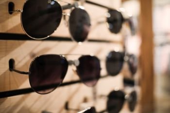 a lot of sunglasses in the store, selected focus.