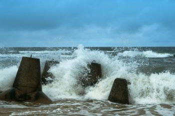 waves break on the breakwater, sea waves on the coastal fortifications. sea waves on the coastal fortifications, waves break on the breakwater