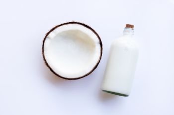 Coconut milk and coconut on  white background