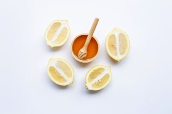 Honey with lemon on white background. Copy space