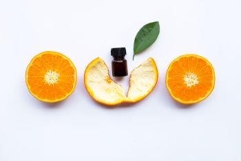Essential oil of orange on white background.