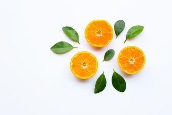Orange fruits with leaves on white background. Copy space