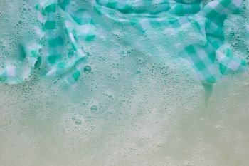 Soak  a cloth before washing.