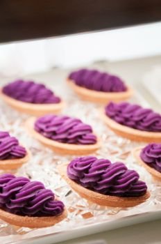 Famous Okinawa Beni Imo tart or sweet purple yam tart, beautiful arrange on tray
