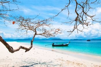 White sand beach and fishing boat at Kang Kao Island, Ranong Province, Thailand.