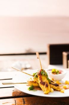 Chicken Satay or malaysian skewer chicken with peanut sauce.