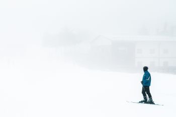 JAN 3, 2018 Kayseri, Turkey : Tourist on Mt. Erciyes ski resort covered with snow in winter on a foggy day
