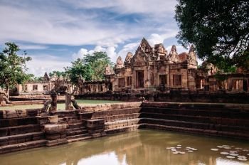 Stone temple and Barai pond of thousand years ancient Khmer architecture of Prasat Muang Tam castle in Buriram, Thailand