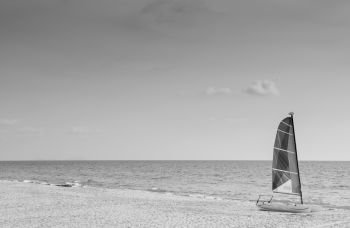 Summer at Bakantiang beach with sailboat against sun in Koh Lanta  with clear sky - Krabi, Thailand. Black and white image