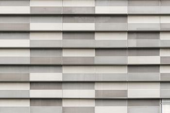 Gray block decorated on modern building. Abstract texture background.