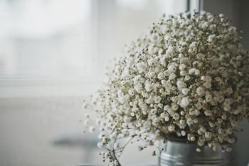 A bouquet of flowers as a table decoration.. Spherical bouquet of white flowers 7774.