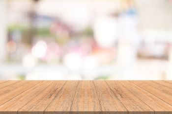 Wood table top on blurred background from shopping mall, Space for montage your products