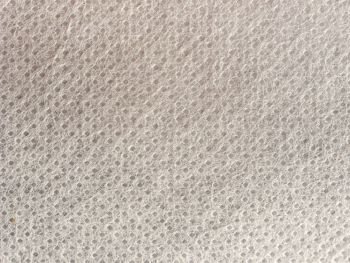 white nonwoven polypropylene fabric texture useful as a background. white nonwoven polypropylene fabric texture background