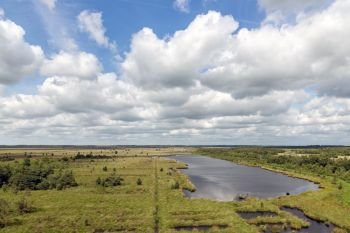 Dutch National park with heath, wetlands and a beautiful cloudy sky. Dutch National park with heath, wetlands and cloudy sky
