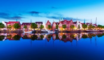 Scenic summer evening panorama view of the Old Town pier architecture in Lubeck, Germany