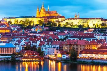 Scenic summer evening panorama of the Old Town architecture with Vltava river and St.Vitus Cathedral in Prague, Czech Republic