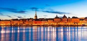 Beautiful evening scenic panorama of the Old Town (Gamla Stan) pier architecture in Stockholm, Sweden