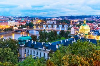 Evening summer scenery of the Old Town architecture with Vltava river and Charles Bridge in Prague, Czech Republic