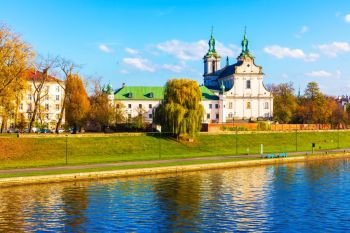 Scenic autumn view of ancient Christian Church at the Vistula river embankment in the Old Town of Krakow, Poland