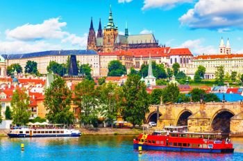 Scenic summer panorama of the Old Town architecture with Vltava river, Charles Bridge and St.Vitus Cathedral in Prague, Czech Republic