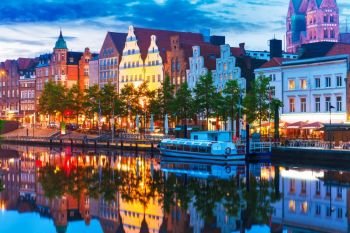 Scenic summer evening view of the Old Town pier architecture in Lubeck, Germany