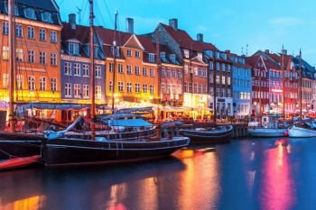 Scenic evening panorama of Nyhavn pier architecture in the Old Town of Copenhagen, Denmark