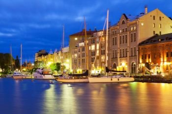 Scenic night view of the Old Port in Katajanokka district of the Old Town in Helsinki, Finland
