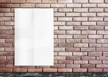 white poster on brick wall 