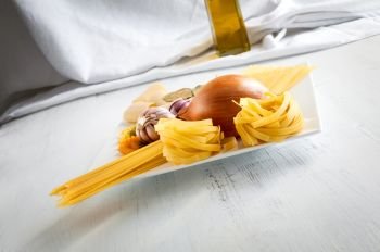 Typical raw Italian pasta with garlic, onion and olive oil