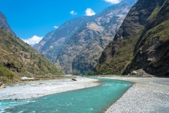 Mountain river near the village of Tal on a Sunny spring day, Nepal.