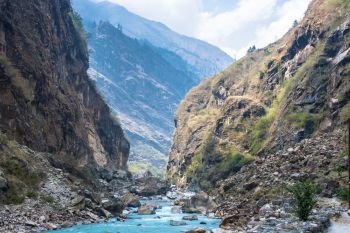 Mountain river in a deep gorge on a spring day, Himalayas, Nepal. 
