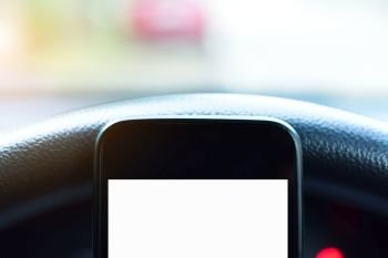 Close up Smartphone using in car,Car pared on road
