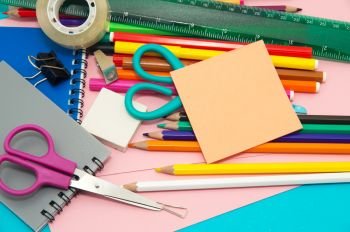 Full background of a colorful assortment of school supplies